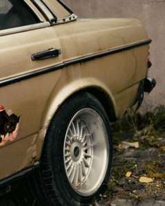 car with damaged window and wheel