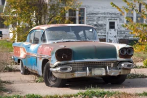 an old junk car parked somewhere, which can be sold.